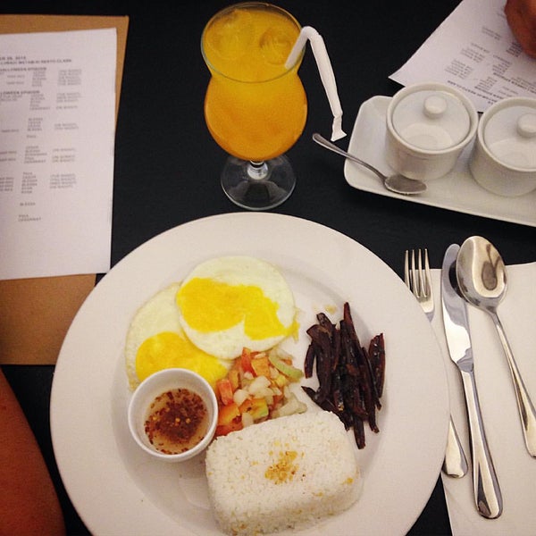 Filipino breakfast plate with rice and eggs at Café Escudero