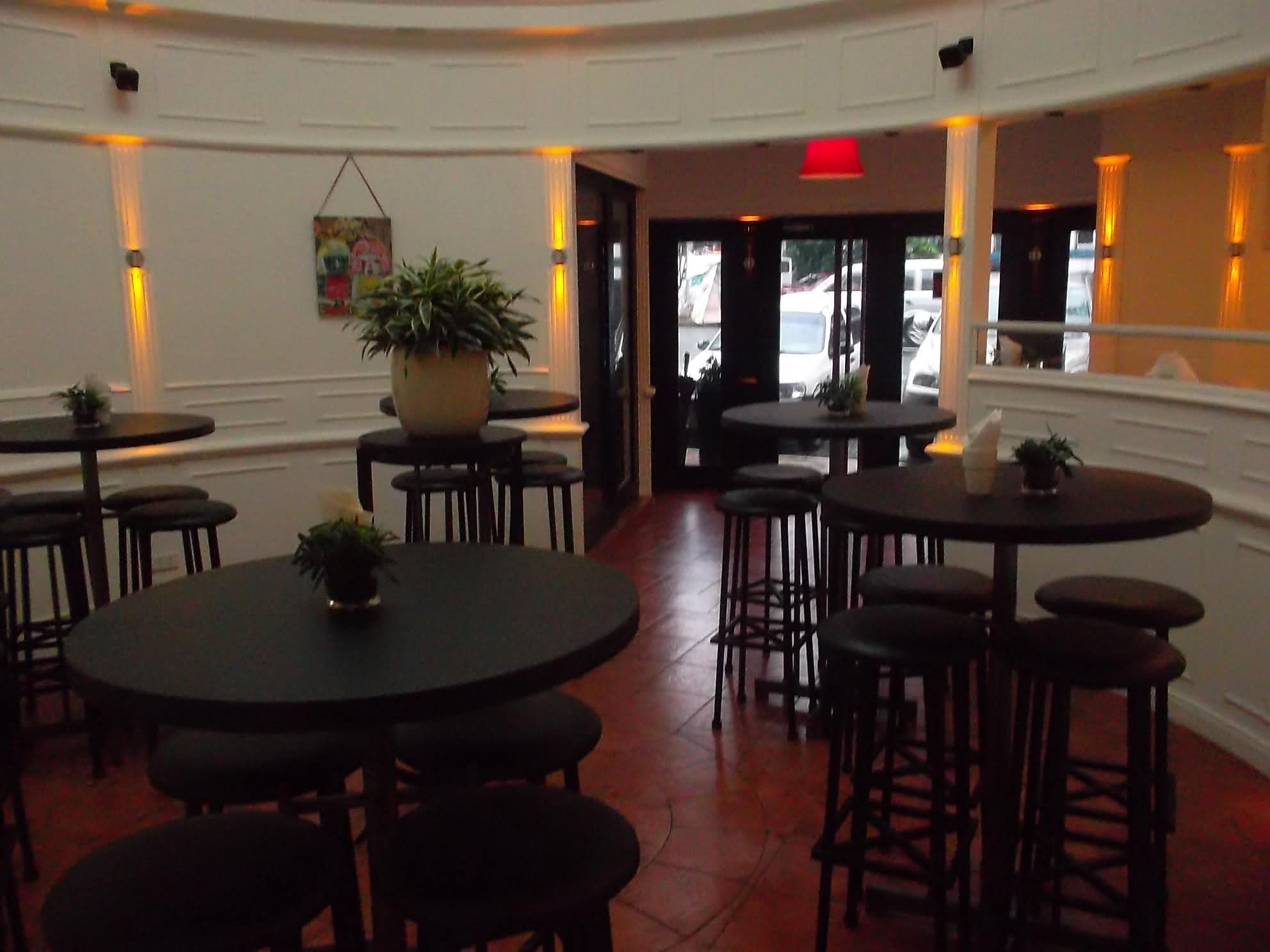 Dining tables arranged inside Café Escudero