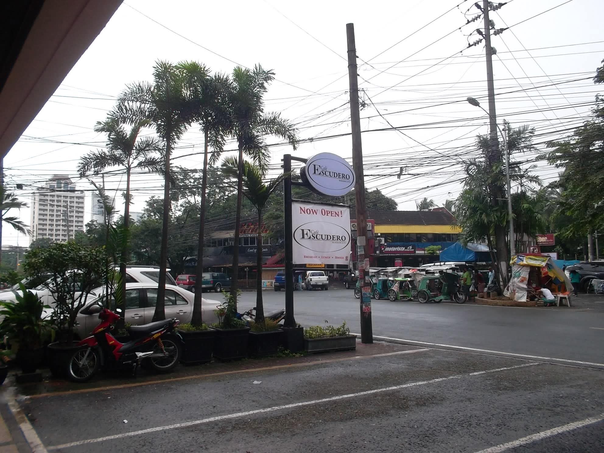 Roadside sign for Café Escudero